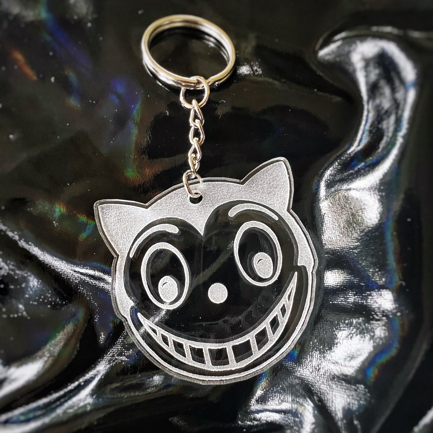 Shreck Cat-inspired earrings and keychains from Batman Returns.