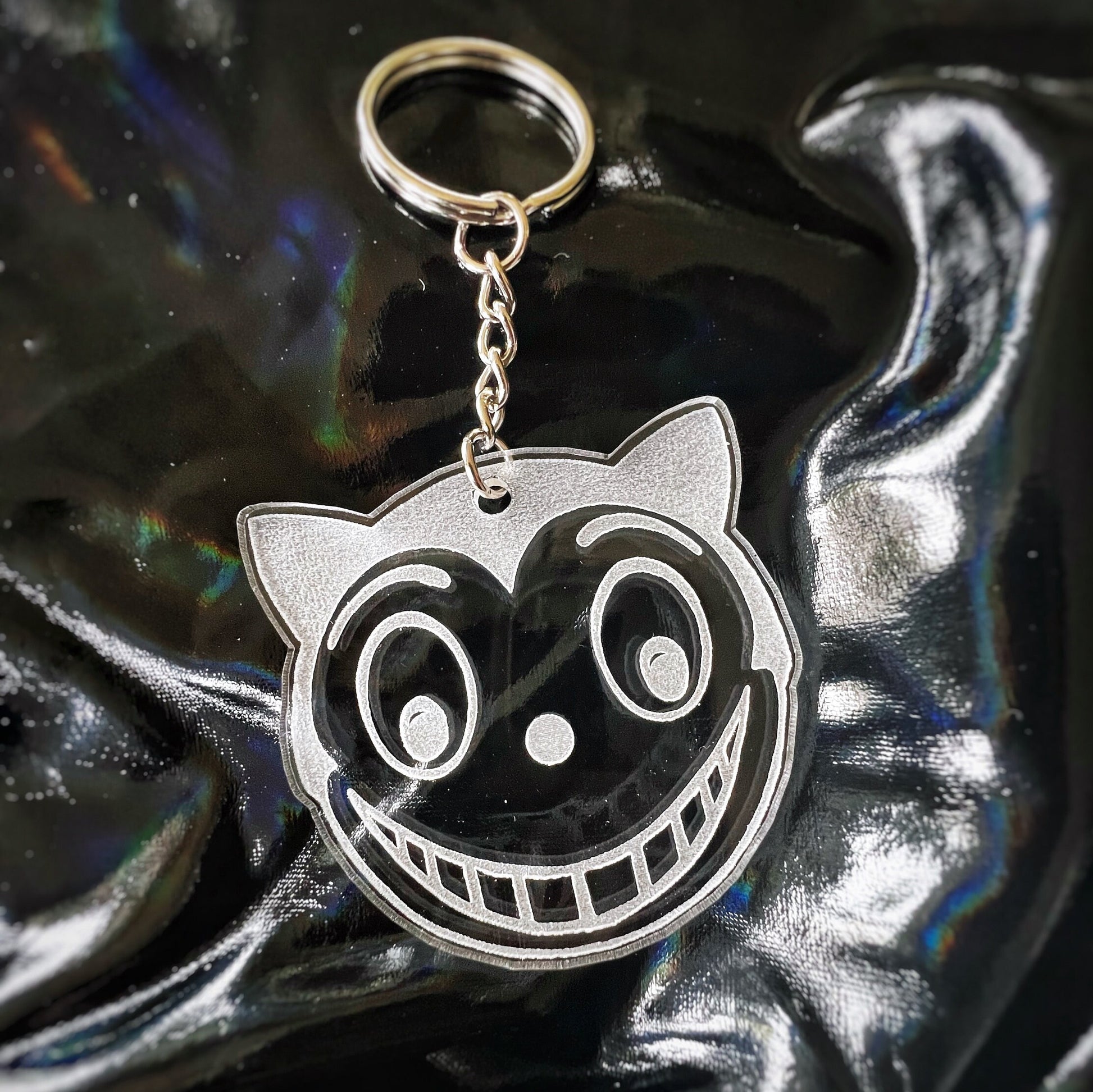 Shreck Cat-inspired earrings and keychains from Batman Returns.