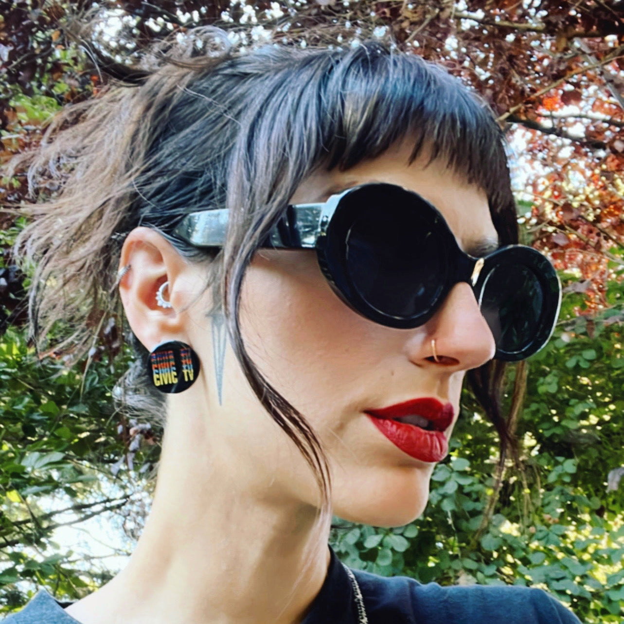 Civic TV Videodrome-inspired handmade pins and earrings for cult film fans.