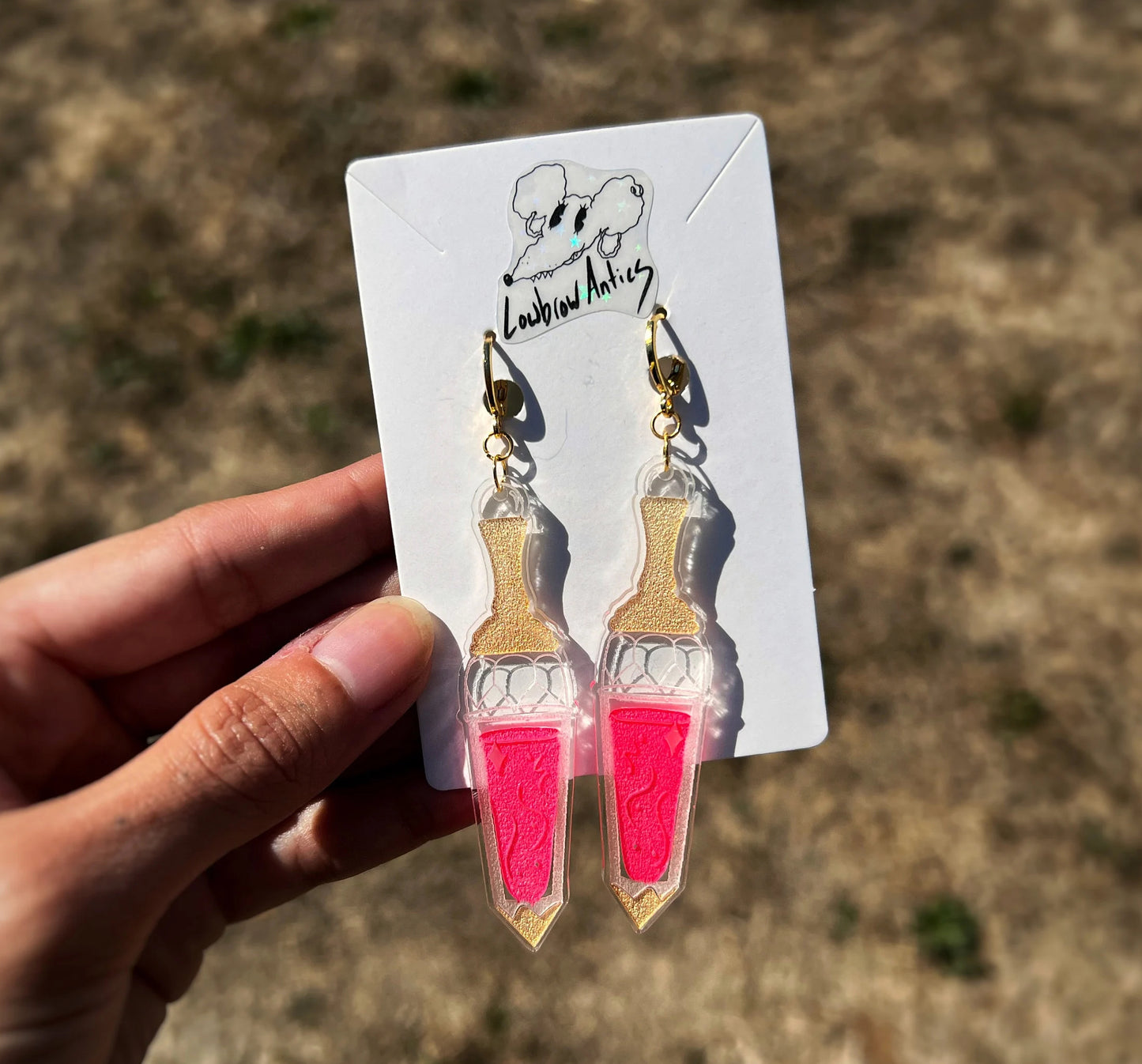 Handmade Death Becomes Her Youthful Tonic-inspired earrings.