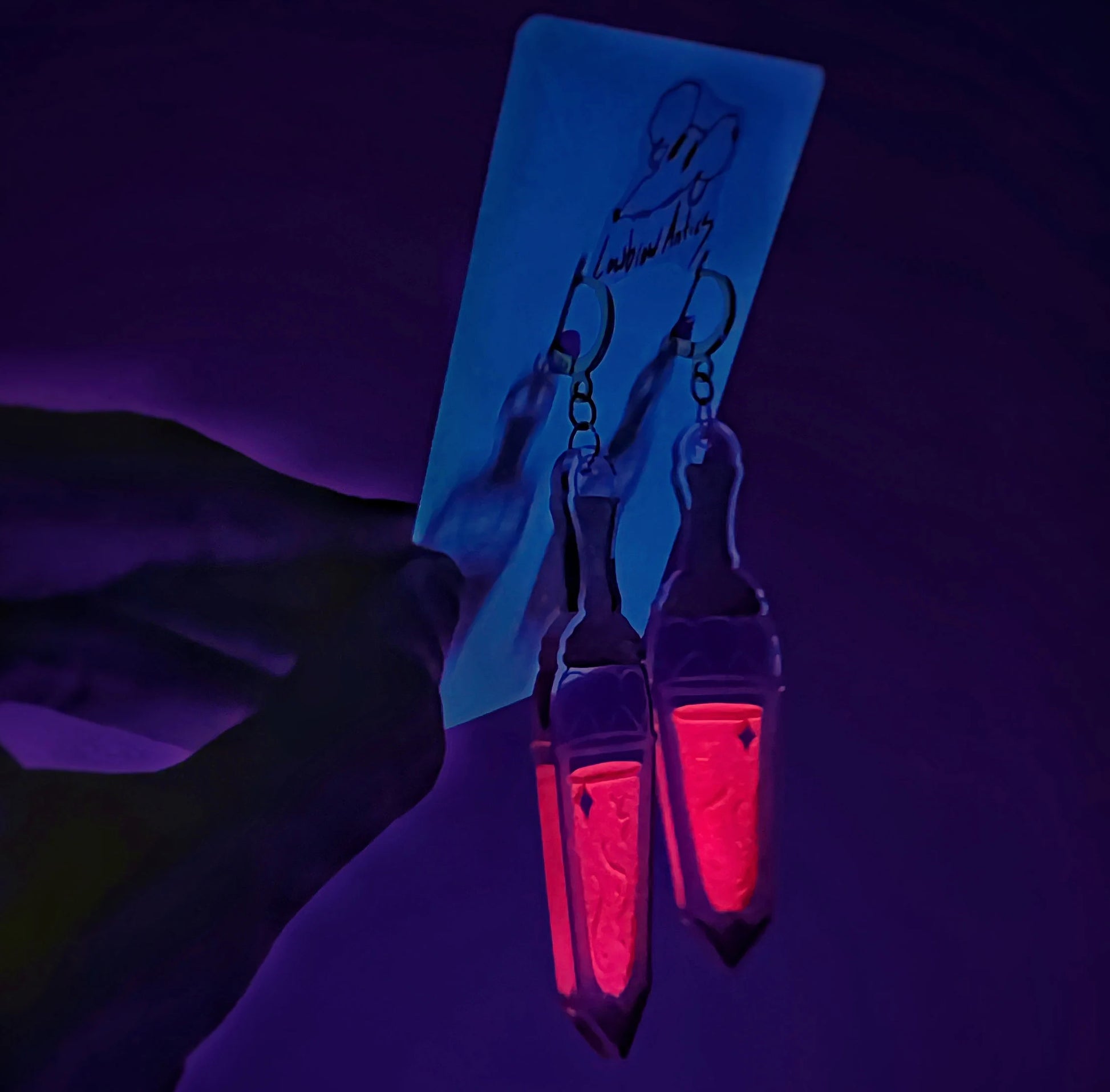 Handmade Death Becomes Her Youthful Tonic-inspired earrings.