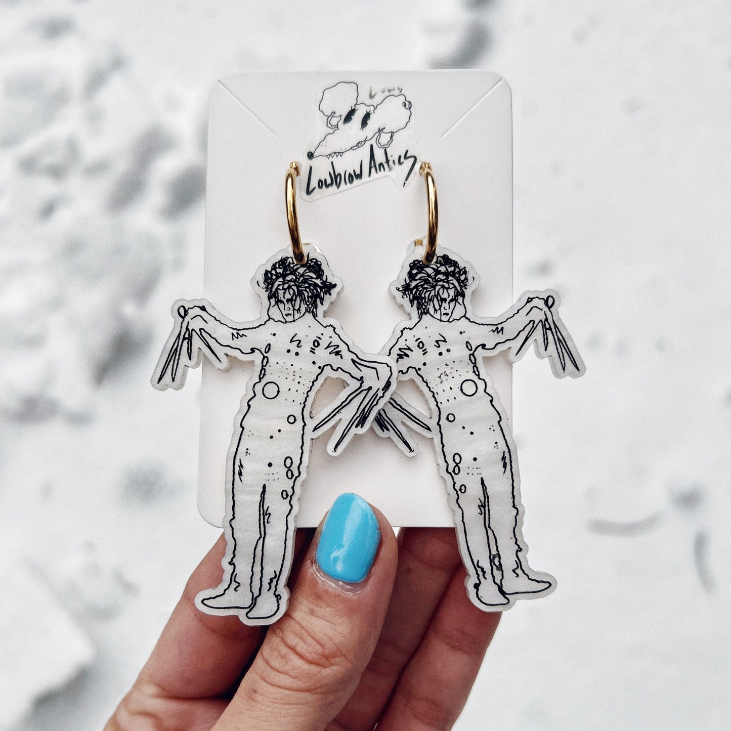 Handmade Edward Scissorhands hoop earrings inspired by Tim Burton’s classic film.