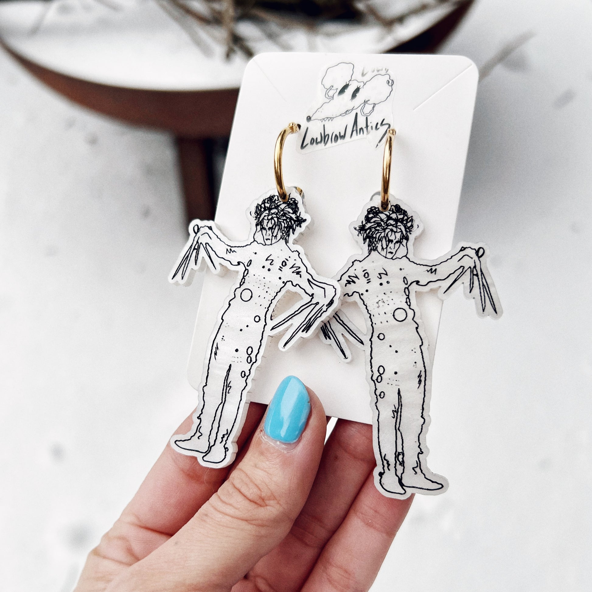 Handmade Edward Scissorhands hoop earrings inspired by Tim Burton’s classic film.