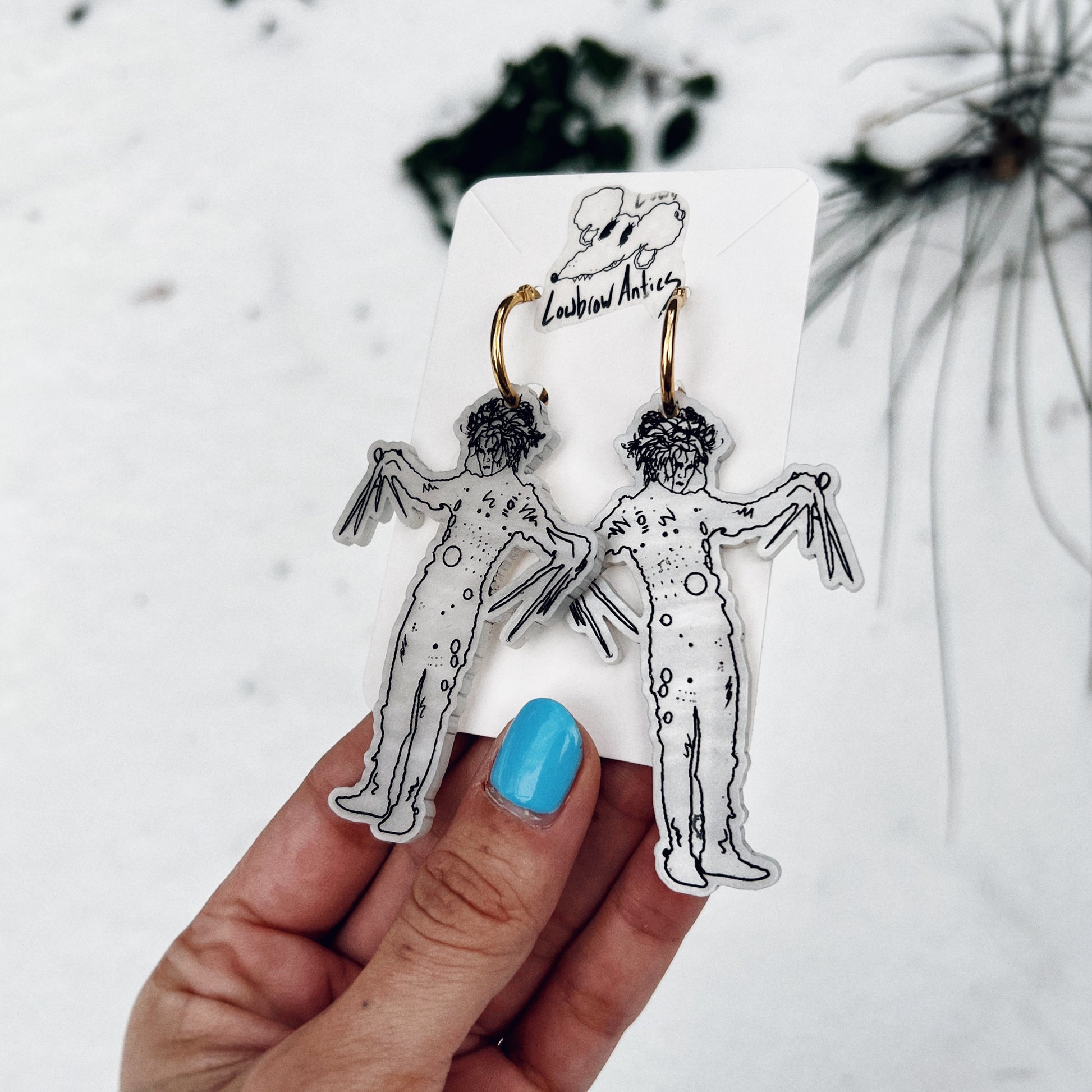 Handmade Edward Scissorhands hoop earrings inspired by Tim Burton’s classic film.