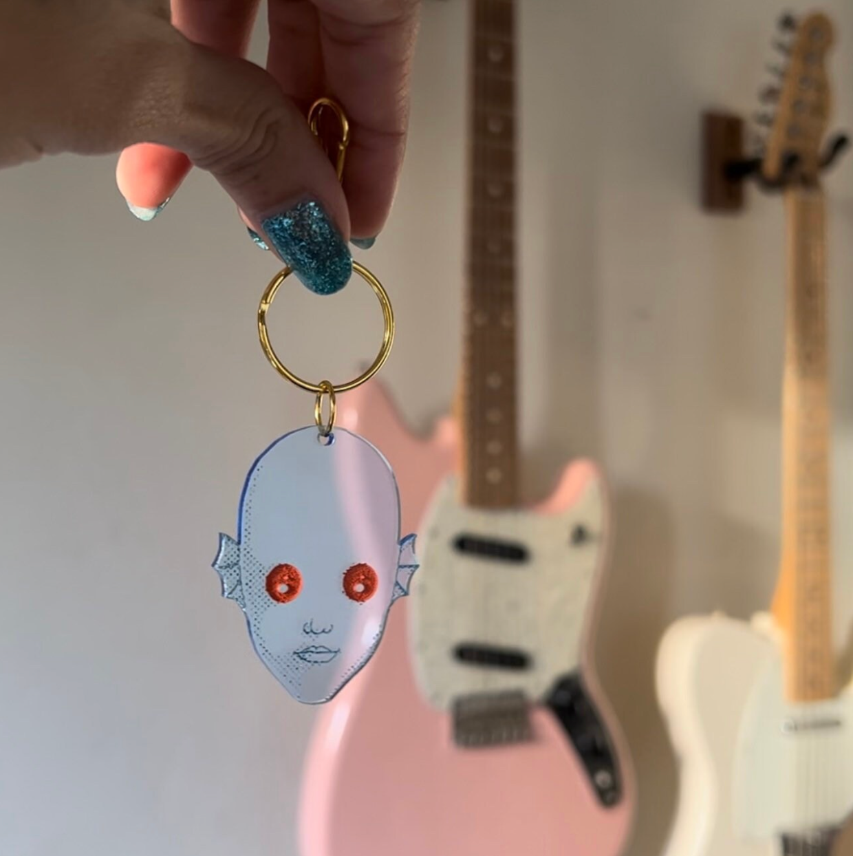 Handmade blacklight keychains inspired by the cult classic Fantastic Planet.