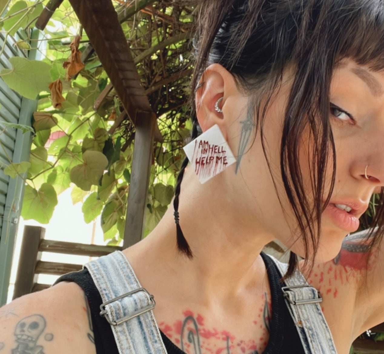 Hellraiser-inspired 'Help Me, I Am in Hell' pin or earring set – perfect horror accessories for fans of Clive Barker's classic.