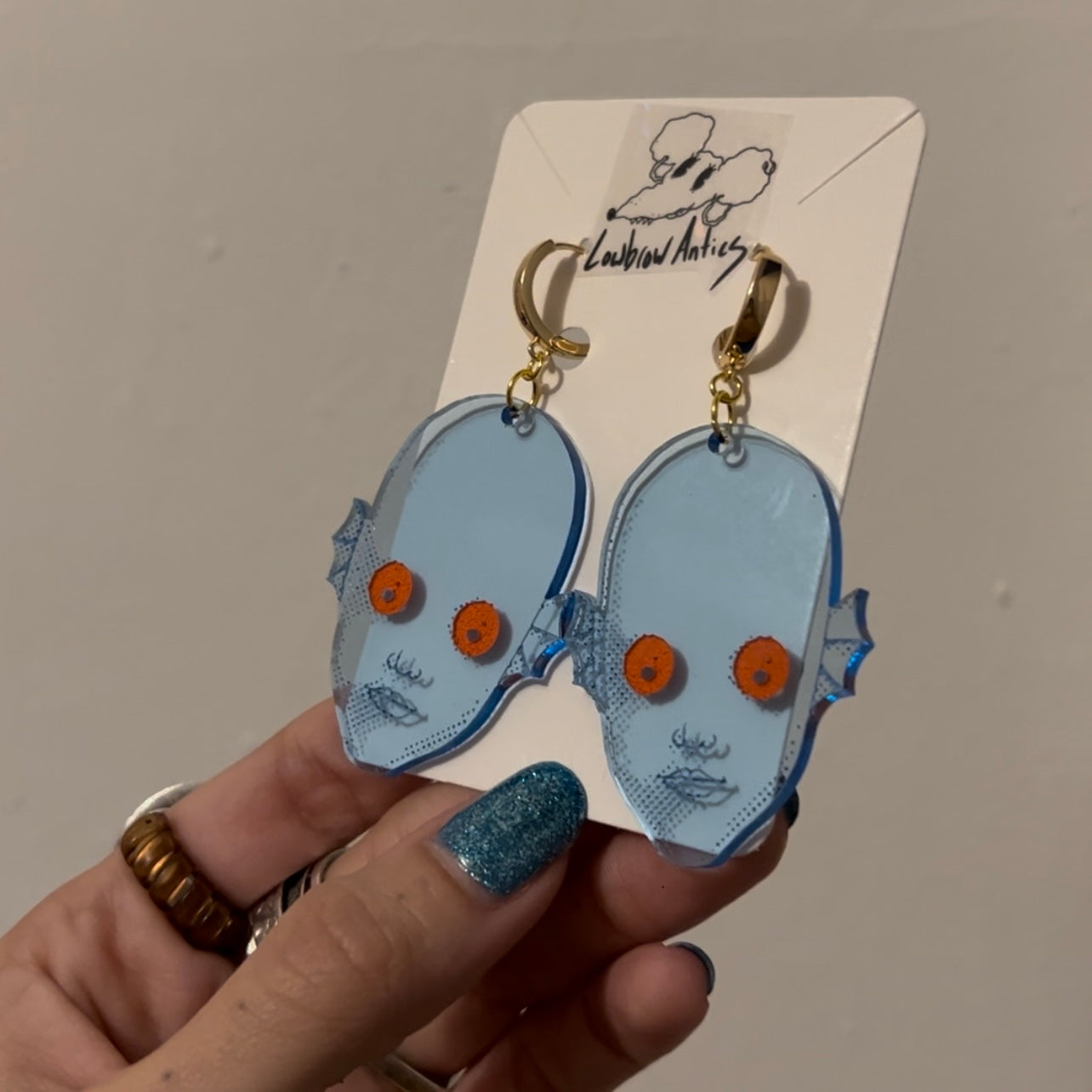 Handmade blacklight earrings inspired by the cult classic Fantastic Planet.