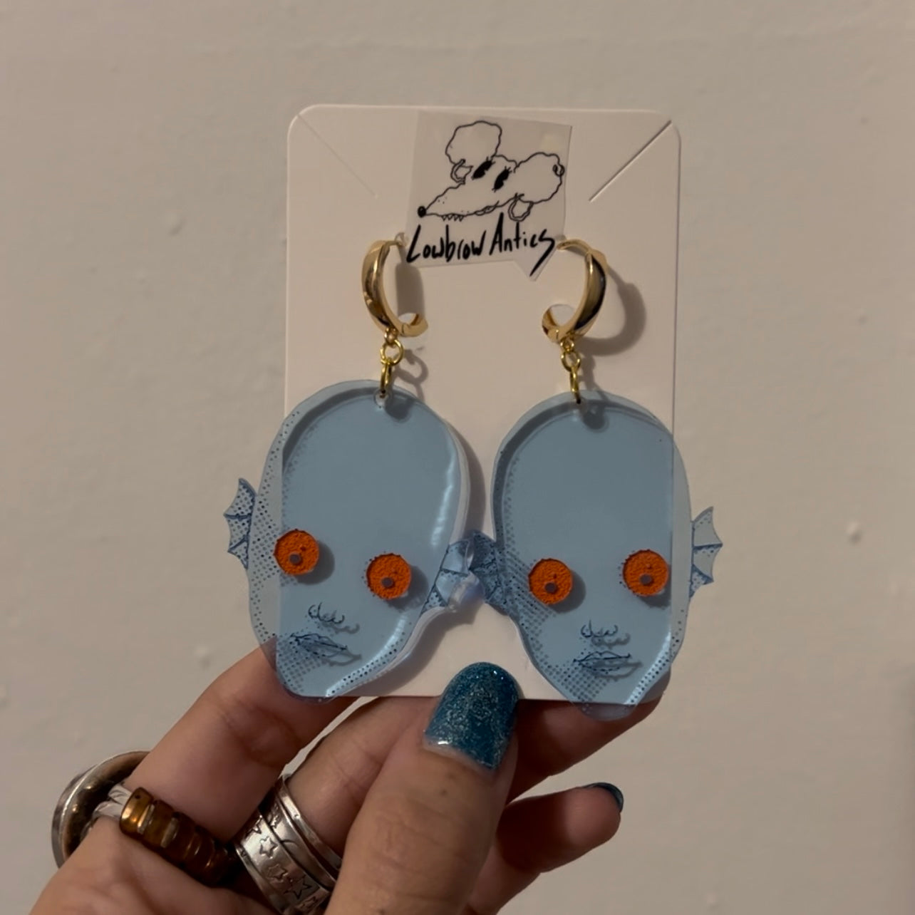 Handmade blacklight earrings inspired by the cult classic Fantastic Planet.