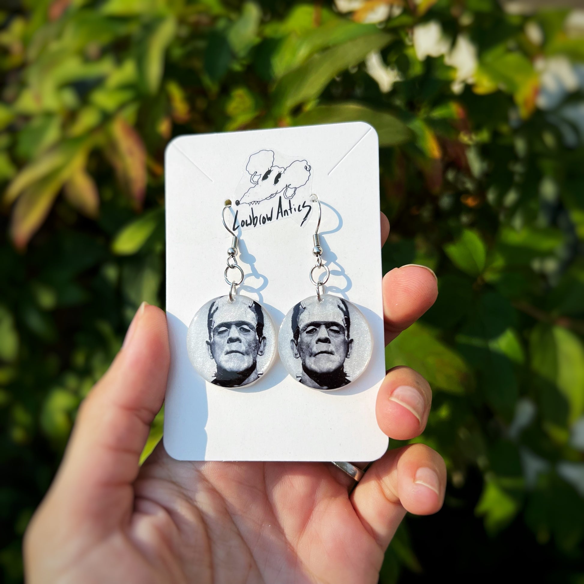 Frankenstein pearlescent black-and-white earrings inspired by classic horror cinema.