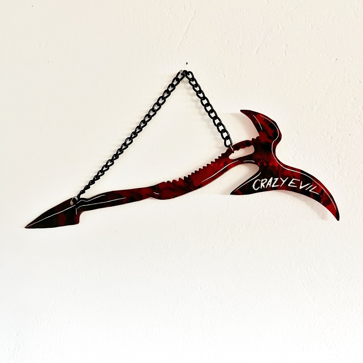 Mandy Movie Merch  - A Replica of the weapon from the film, called "The Beast". Large red and black swirled syth-axe hybrid hanging from a black chain.