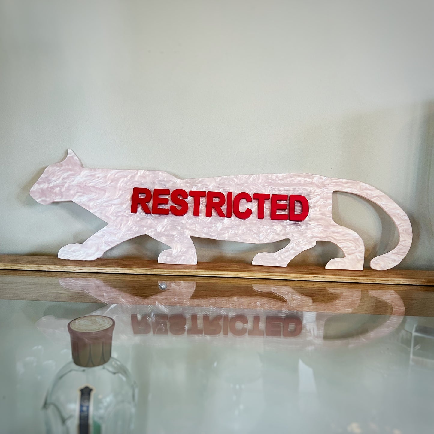 Example of a finished Restricted Panther Wall Art Piece by Lowbrow Antics, in Pink and Red Pearl Colorway.
