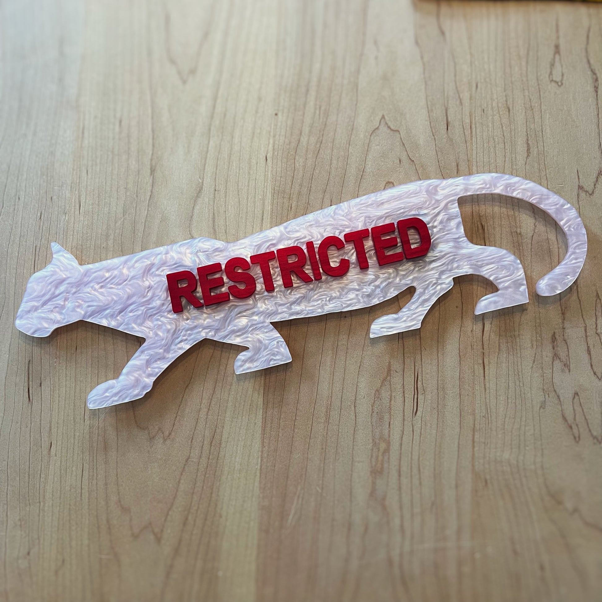 Example of a finished Restricted Panther Wall Art Piece by Lowbrow Antics, in Pink and Red Pearl Colorway.